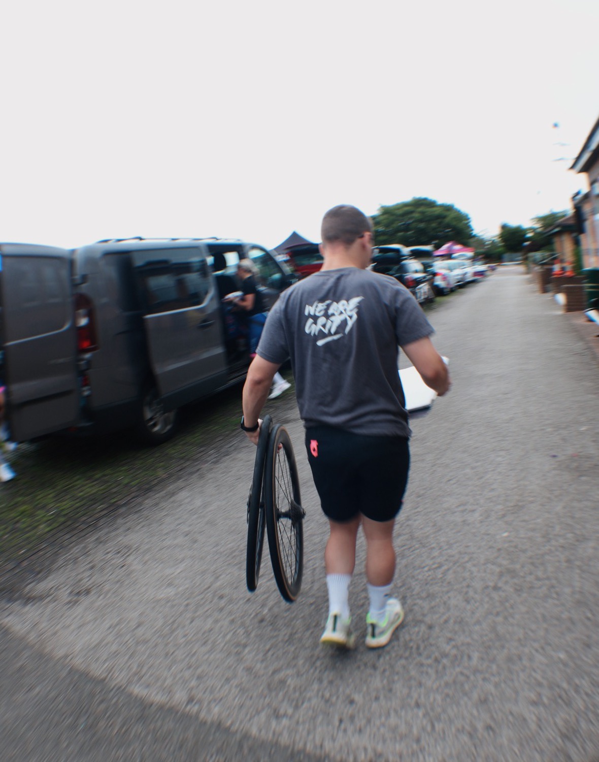 Matt carrying a wheel back to the team van at a race weekend
